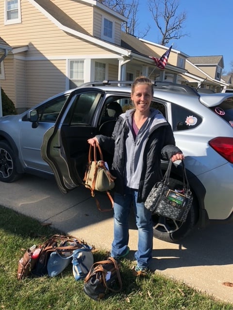 Lindsey from Heartly House in Frederick picking up 16 purses filled with personal items.  These will be given to the women there.